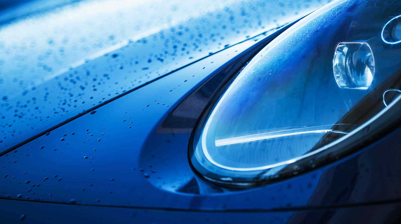 Modern automotive industry background showcasing professional car care technology and equipment
